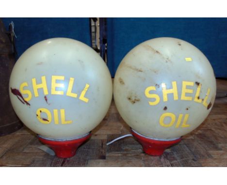 Pair of globe light fittings with Shell Oil attached labels. Condition reports are not availabe for our Interiors Sales.