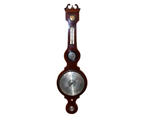 A 19th century mahogany wheel barometer by C. C. G &amp; Co 34 St. John's Lane, London. The mahogany case has swan-neck pedim