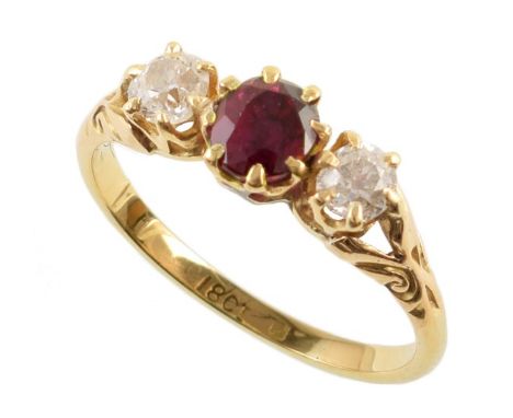 Ruby and diamond 3-stone 18ct yellow gold ring , central round mixed cut red spinel measuring approx. 5.3mm diameter, two rou