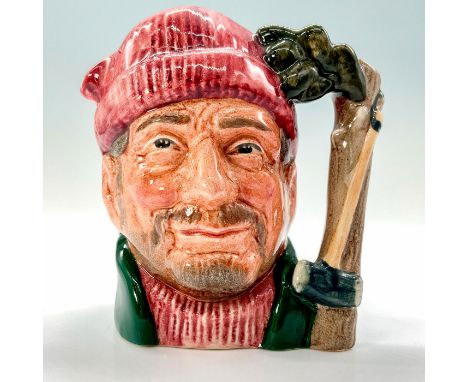 A jug that depicts a middle-aged lumberjack wearing a read beanie and green jacket with a tree trunk and axe for the handle. 