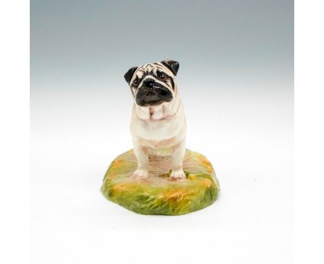 Hand painted dog figural with light body coloring, black ears and nose standing on grass colored base. Royal Stratford backst
