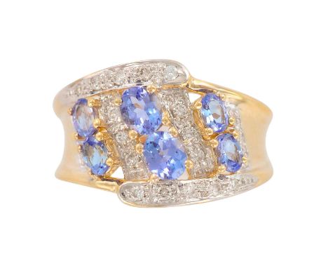 An absolutely lovely contemporary ladies ring with diamonds and tanzanite weighting 1.25ctw. Weight 6.93 grams. Size 8.5. Mar