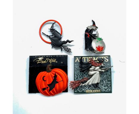 Pin 1: Silver tone witch with red hair wearing a black cape, boots, and hat. 3"L x 2.25"W. Pin 2: Pumpkin with witch on flyin