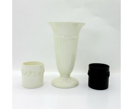 The vase and one votive holder are white glazed with Etruria backstamp.The black basalt votive holder is stamped Wedgwood. Th