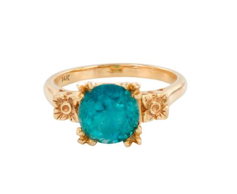 Delicate ladies ring with floral details and an eye catching round blue topaz in the center. Weight 4.6 grams. Size 6.5. Mark