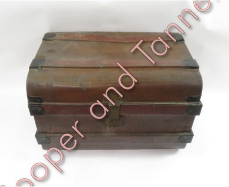 A painted metal travelling trunk with brass lock