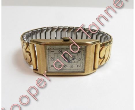 H&amp;R Marsh, Bath, a gentleman's 9 carat gold wrist watch, the rectangular signed dial with black Arabic numerals, and blue