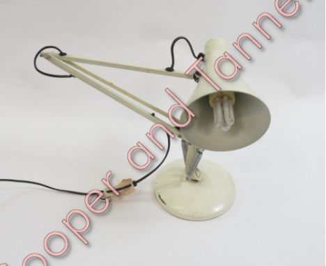An angle poise lamp in cream painted metal
