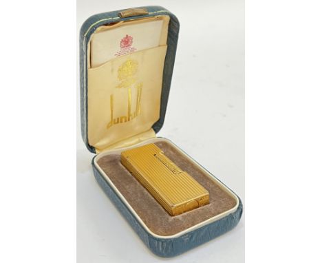 A gold plated Dunhill roller cigarette lighter (marks to base, h- 6.5cm), complete with original case