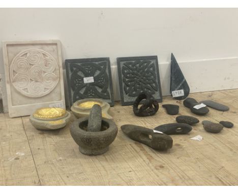 A mixed group of Celtic-styled stone carved items, including two bright gilded quaiches, white marble panel, green marble car