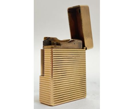 A gold plated Dupont cigarette roller lighter with horizontal striped design (marks to base, h- 5cm)