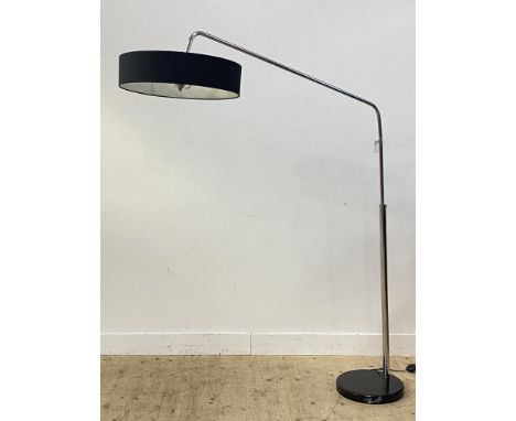 A contemporary chrome plated rise and fall arc lamp standard, with three bulb holders, cylindrical shade and on a marble base
