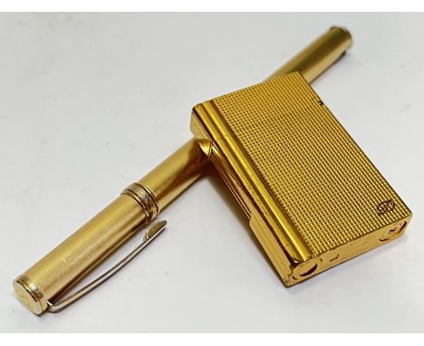 A gold plated Dupont cigarette roller lighter with hobnail design (marks to base, engraved cartouche, h- 6cm), together with 
