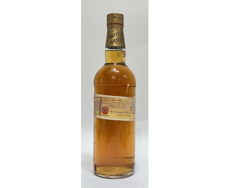 A gold cap bottle of White Horse Scotch whisky