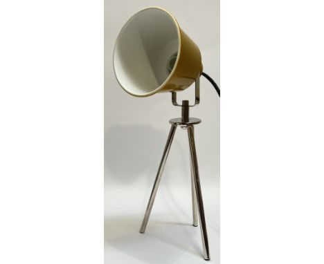 An adjustable table lamp with yellow enamelled shade and chrome plated tripod support (h- 48cm)