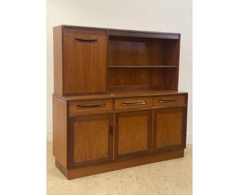 G-Plan, a 1970s teak Fresco sideboard. The raised back fitted with illuminated glass shelf, flanked by a fall-front cocktail 