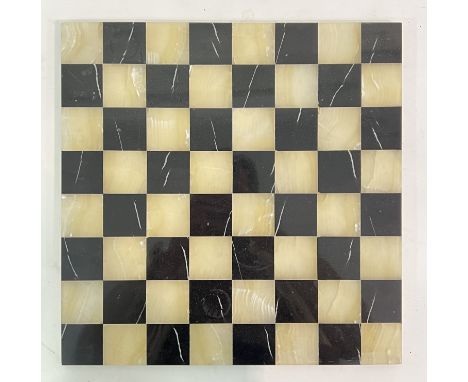 A hardstone inlaid chessboard, probably marble and alabaster/onyx (w- 35.5cm)