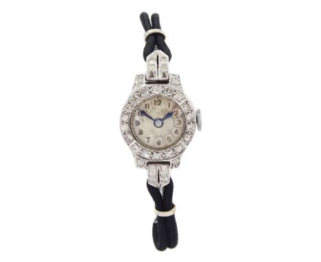 Art Deco platinum diamond set manual wind wristwatch, on black cord bracelet, with 9ct white gold clasp, casedCondition Repor