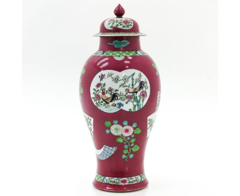 Ruby red ground decorated with flowers and rooster in Famille Rose enamels, 47 cm. tall, chip and hairline on rim.