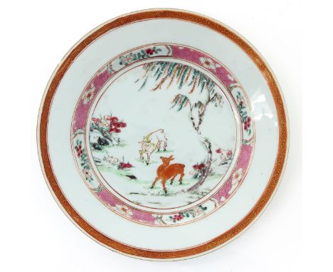 Depicting deer in garden landscape with floral border, 22 cm. in diameter, light fritting on edges.