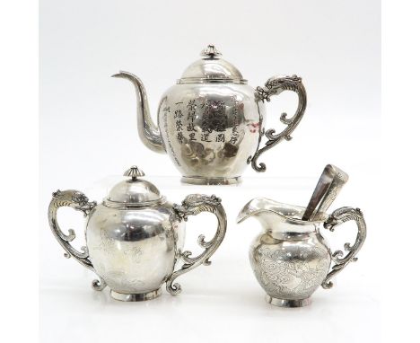 Including teapot, creamer, sugar and sugar tong, chinese hallmarks on bottom, teapot is 15 cm. tall.