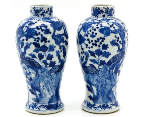 Decorated with flowers and peacocks, Kangxi mark, 23 cm. tall, small chips on edge.