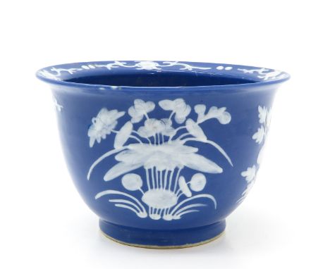 Light blue ground with raised white floral decor, 27 cm. in diameter.