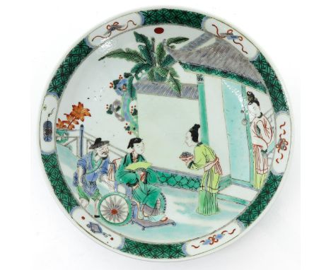 Depicting Chinese figures in garden, Kangxi mark, 28 cm. in diameter.