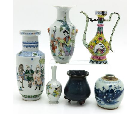 Including four vases, a ginger jar, and enamel teapot, tallest vase is 28 cm., in diverse conditions. 