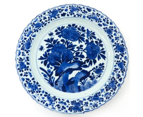 Floral decor, Kangxi mark and period, 36 cm. in diameter, baking fault on edge.