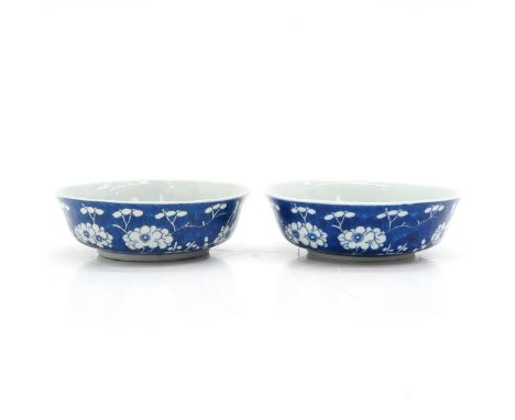 Dark blue ground with white floral blossom decor, Kangxi mark, 13 cm. in diameter. 