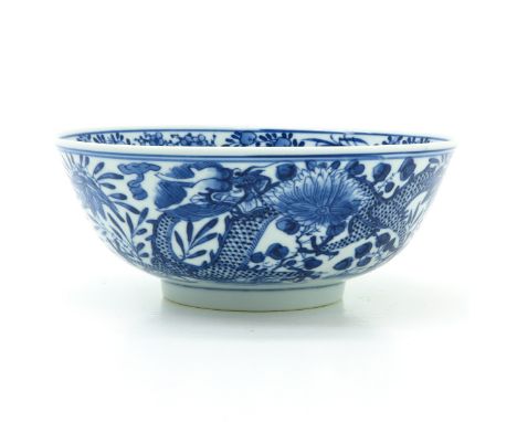 On raised circular base, decorated with flowers and dragons, Kangxi mark, 18 cm. in diameter.