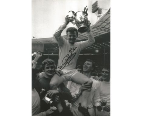 Football Jack Charlton signed 12x8 black and white vintage photo pictured celebrating with his Leeds United team mates. Good 