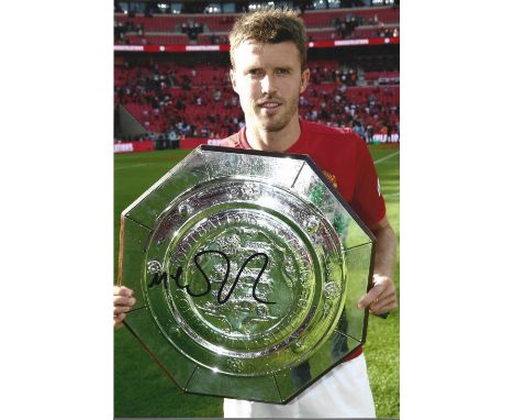 Michael Carrick signed Manchester United 12x8 colour photo. Michael Carrick (born 28 July 1981) is an English professional fo