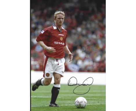 David May signed Manchester United 12x8 colour photo. David May (born 24 June 1970) is an English football coach and former p