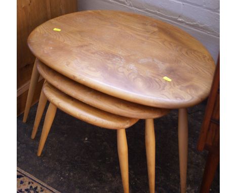 Nest of three Ercol light wood pebble top tables
