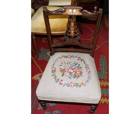 Victorian mahogany nursing chair with carved inlaid and marquetry back and floral tapestry seat pad