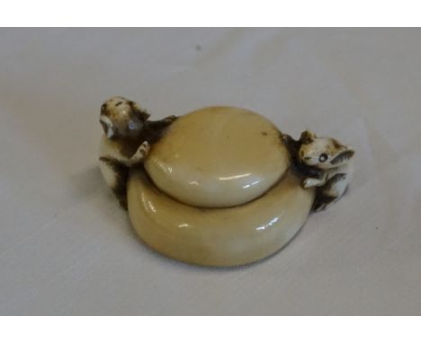 Japanese ivory netsuke - study of two mice feeding on a loaf of brad inscribed signature on base. Late 19th early 20th centur
