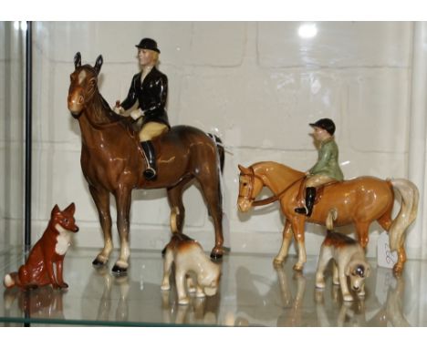 Beswick models of a huntsman, a girl on a pony, two hounds and a fox