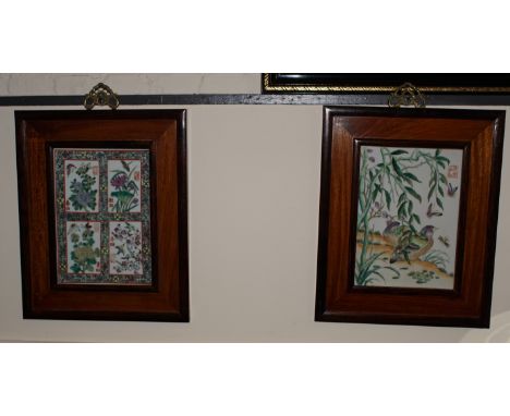 Two 20th century hand painted enamel plaques depicting bird and flowers in hardwood frames 30 x 22 cm