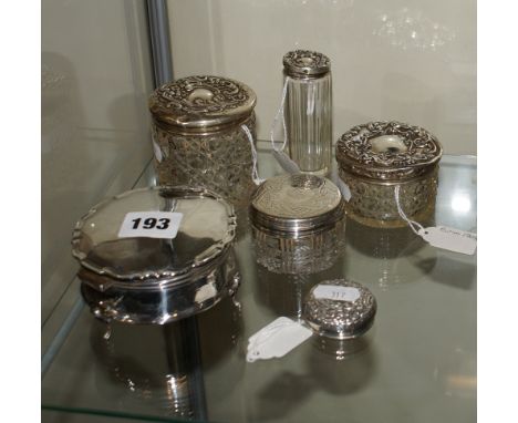 Silver trinket box, four glass jars with silver lids and a spare lid