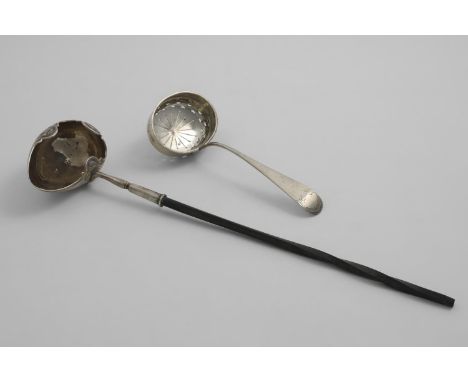 A GEORGE I / II PUNCH LADLE with an egg-shaped bowl and a shaped rim, chased with three stylised shells, initialled "ES", leo