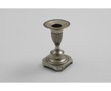 AN EARLY 19TH CENTURY PORTUGUESE SHORT CANDLESTICK on a canted square base, with a fluted capital, maker's mark partially unc