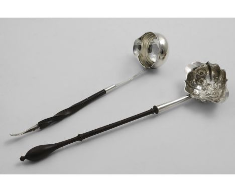 A LATE GEORGE II DOUBLE-LIPPED PUNCH LADLE with a turned wooden handle and an embossed bowl, initialled "AH" on one side, by 