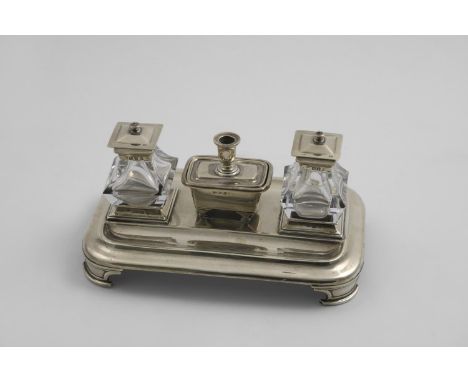 A VICTORIAN RECTANGULAR INKSTAND with rounded corners, bracket feet and two pen depressions, fitted with two mounted glass in