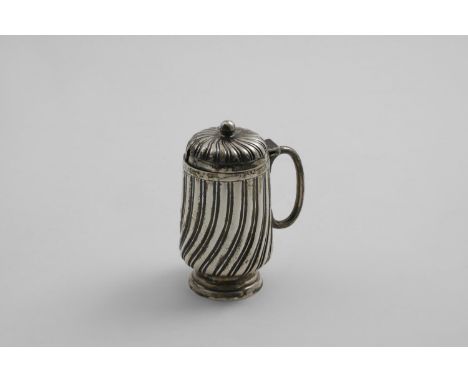 A VICTORIAN MUSTARD POT with wrythen-fluted decoration, a ball finial &amp; gilt interior, by Edward Hutton, London 1889; 4" 