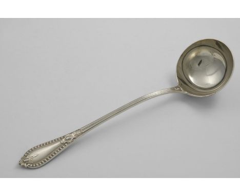 AN EARLY 20TH CENTURY GRECIAN PATTERN SOUP LADLE maker's mark "F.N.&amp; S.LTD", London 1913;  14"  (35.6 cms) long;  10.1 oz