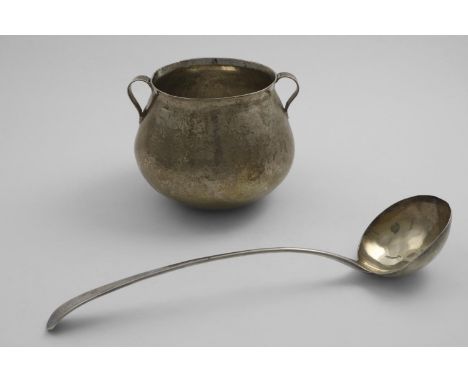 A 19TH CENTURY TWO-HANDLED CUP shaped like a cauldron, unmarked, probably South American, and a George III Old English patter