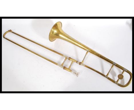 A 20th Century brass J. R. Lafleur &amp; Sons trumpet no. 17276 in a leather carrying case, with mouthpiece. Case measures 20