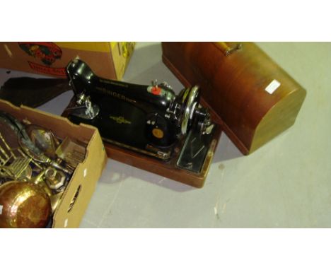 Vintage Singer sewing machine in wooden case